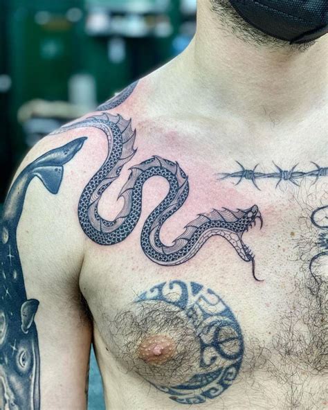 snake chest tattoo